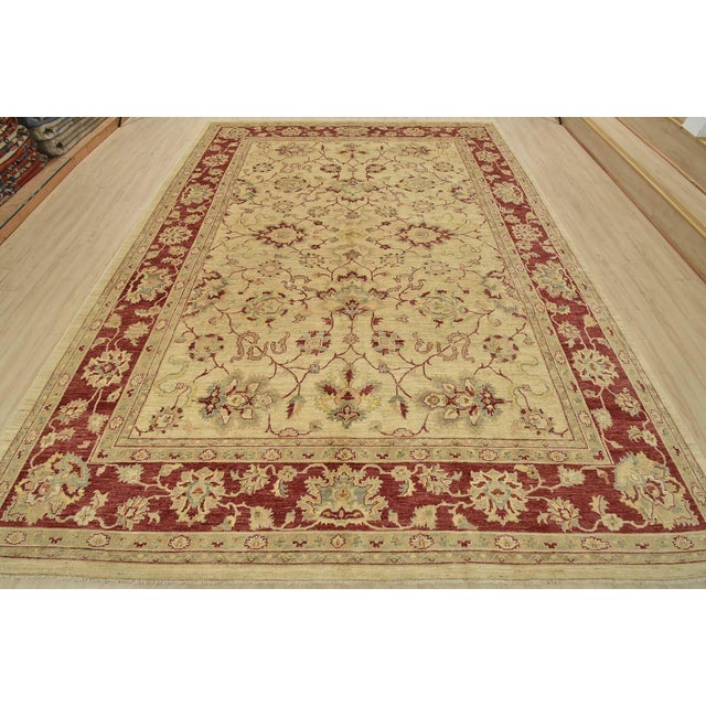This traditional Ziegler rug is hand-knotted with an all-wool pile on a cotton foundation. This rug is new and in...
