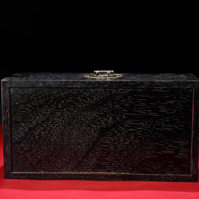 A refined Chinese hardwood trinket or jewelry box, crafted from dense, deep-toned zitan-style rosewood with fine, dense...
