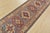 A tribal Caucasian Kazak runner hand-knotted with fine wool on a cotton foundation. This rug features a row of geometric...