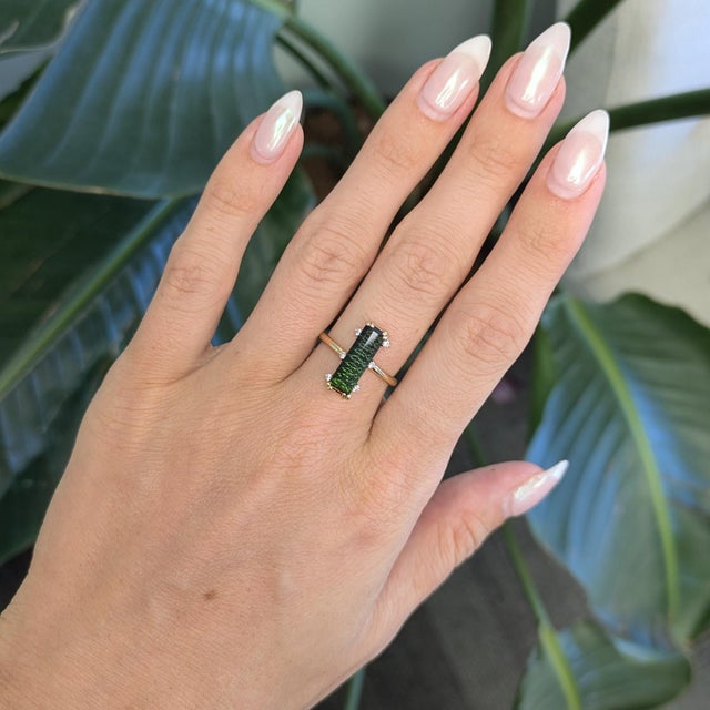 Stunning 2.5ct black tourmaline, 16x4mm, set in solid 14K gold with natural diamond accents. A striking balance of...