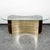 Unique 1970s Italian dining table. The oval glass top sits on a curved mirrored base with brown velvet detailing....