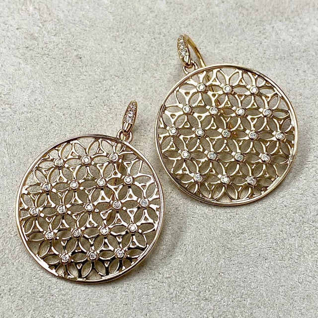Created in 18 karat yellow gold Flower of life motif Diamonds 0.20 ct approx Limited edition These Candy Blue Topaz &...