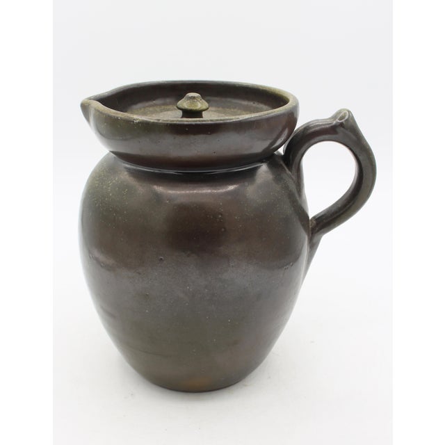 1960-1972 Ben Owen Master Potter stamped lidded pitcher. Frogskin glazed in a traditional English style. Fine shaped...