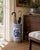 A classic blue and white porcelain umbrella stand in the chinoiserie tradition, featuring finely rendered birds among...