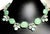 This necklace combines several prized gemstones in a harmonious palette of blue, green, and yellow tones. Moss Aquamarine,...