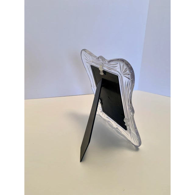 Vintage very heavy glass frame in excellent condition. It measures 8.25" x 10" for a 4.5" x 6.5" photo.