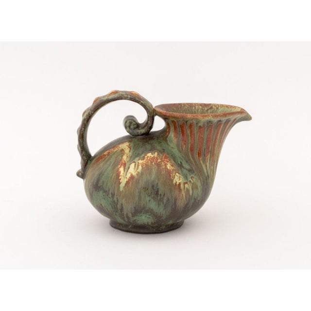 Michael Andersen and Sons Glazed Pottery Pitcher, mid-20th century, dripped green glaze, inscribed "Denmark" and with...