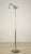 1920s-1930s floor lamp with a mythic figural theme centered on the hippocampus motif at top. A marbled celluloid grip on...