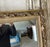 A louis xvi style fireplace mirror in repainted gray and gold wood, circa 1850. Rich wood ornamentation with ribbons and...