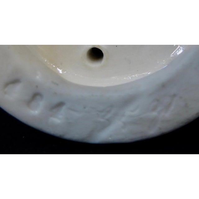 This vintage porcelain cabinet figurine is French & dates from the 19th century. The standing figure of a young Parisian...