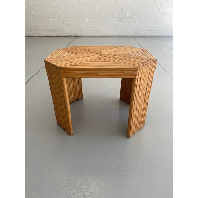 Late 20th century split Reed bamboo coastal style octagonal shaped side table . Table features a graphic x design to the...