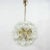 Awesome glass and brass dandelion chandelier, made in Germany in the 1960s. The chandelier has got twelve lights and 52...