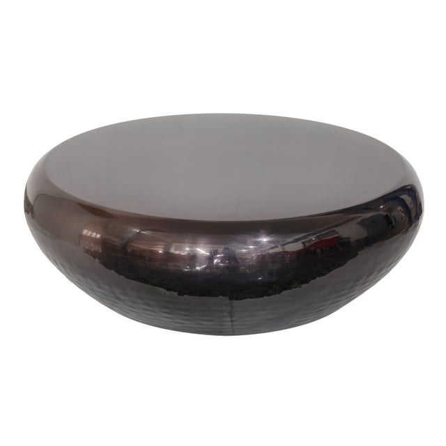 Modern geometry adds up to beautiful entertaining with the Helois faceted coffee table. Crafted of iron with a brass...