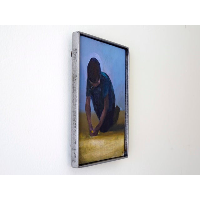 Figurative The Charmer by Emma Kalff | Oil on canvas panel Boy kneeling and playing with a toy on the ground. For Sale - Image 3 of 5