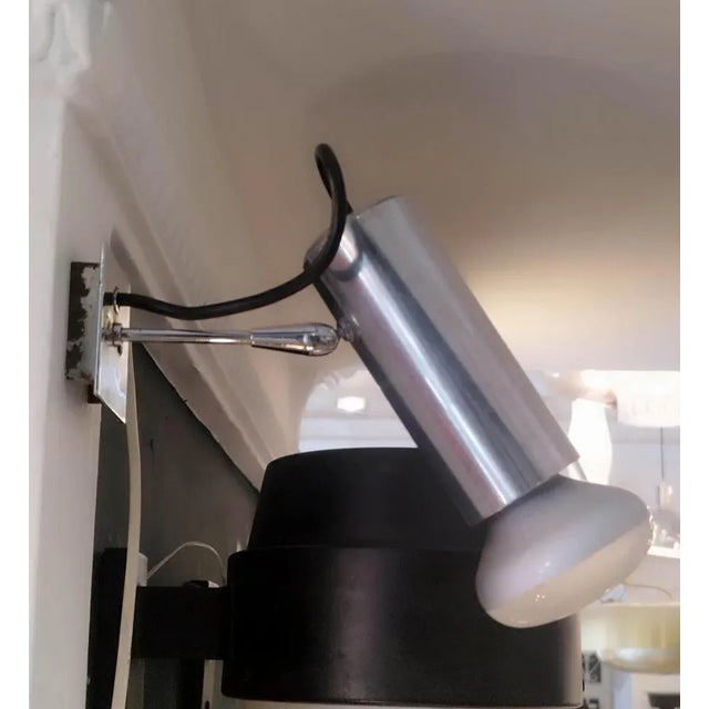 Wall sconce Mod. "36" in chromed metal designed by Gino Sarfatti for Arteluce, Italy 1955. The lamp is structured with a...