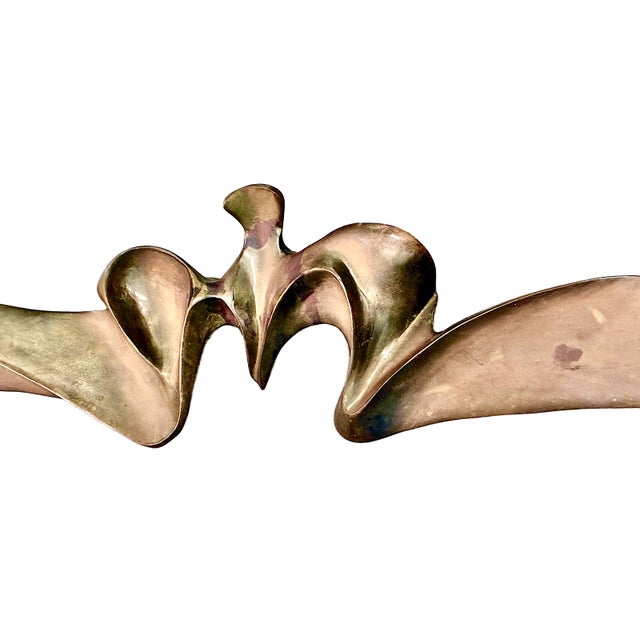 This large, horizontal bronze sculpture is a modernist work typically referred to as "Bird" or "Bird in Flight." Made of...