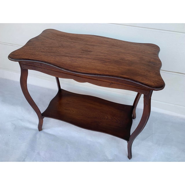 Art Nouveau side table from the 1950s, made of ash wood and an upper tabletop made of plywood veneered with natural oak...