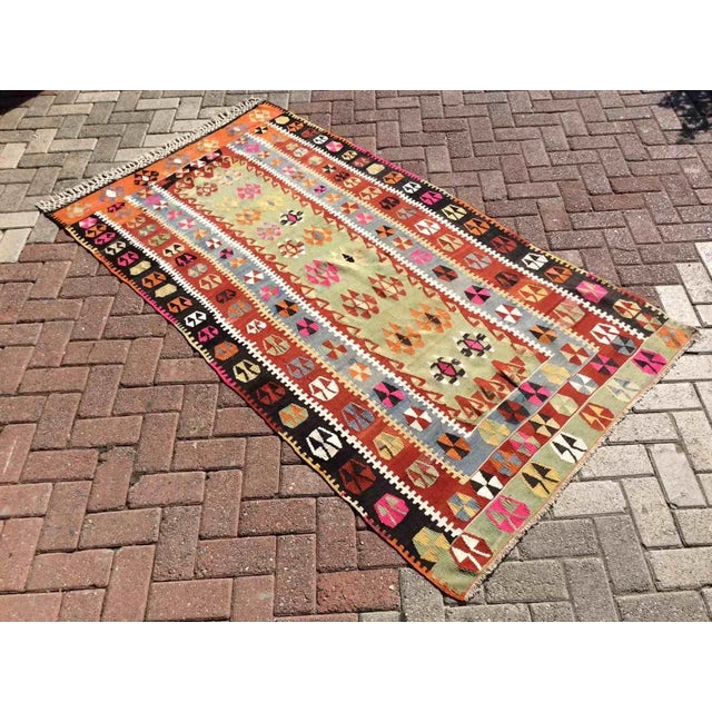Introducing a stunning Turkish Kilim rug crafted from the finest quality all wool. This one-of-a-kind piece features...
