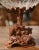 A finely carved walnut base depicting an alpine woodland scene gives this antique Black Forest centerpiece its distinctive...