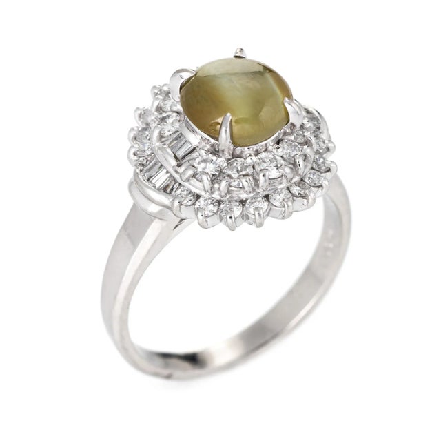Stylish cat''s eye chrysoberyl cocktail ring crafted in 900 platinum. Cat''s eye chrysoberyl measures 8mm x 6.5mm (2.21...
