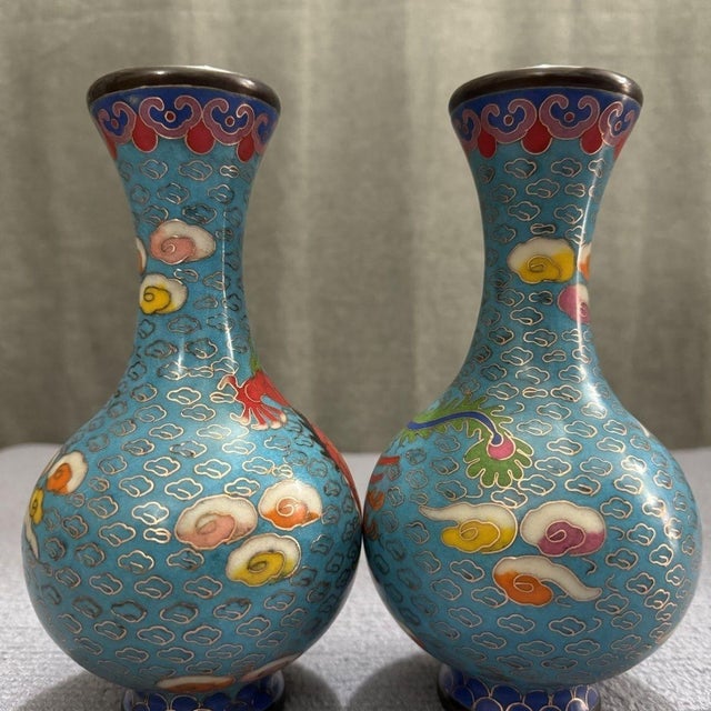 Elevate your interior with this breathtaking Pair of Vintage Cloisonné Enamel Dragon and Phoenix Vases. In traditional...