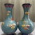 Elevate your interior with this breathtaking Pair of Vintage Cloisonné Enamel Dragon and Phoenix Vases. In traditional...