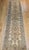 "Discover the refined elegance of this captivating Vintage Persian Kerman Runner, a testament to the celebrated weaving...