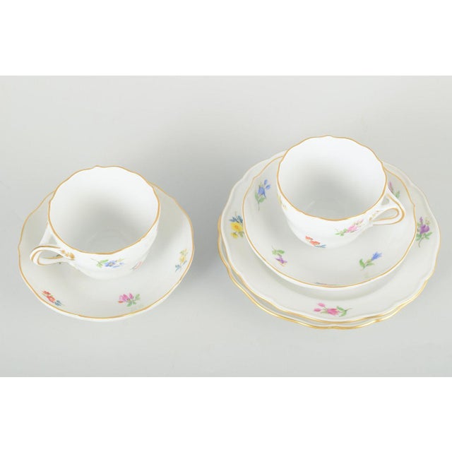Meissen 2 mocha cups with saucers and plates, mid-20th century. Set consisting of 2 hand-painted mocha cups with saucers...