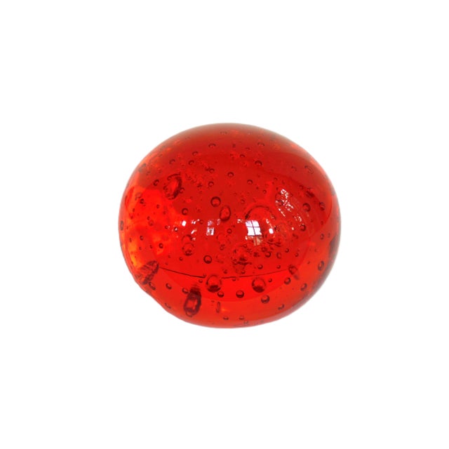 A vintage handblown red glass sphere with bubbles. A great addition to any home. Let me know if you have any questions....