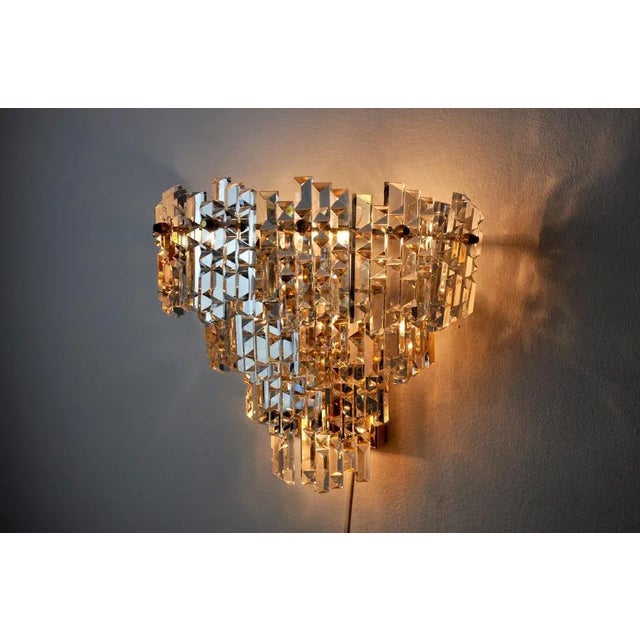 Superb and large wall lamp kinkeldey designed and produced in Germany in the 1970s. Cut crystals distributed on three...