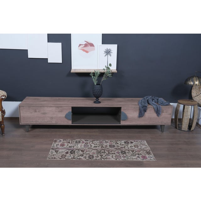 Bring organic, rustic warmth to your home with this authentic 1970s handwoven Anatolian small runner. Featuring intricate...