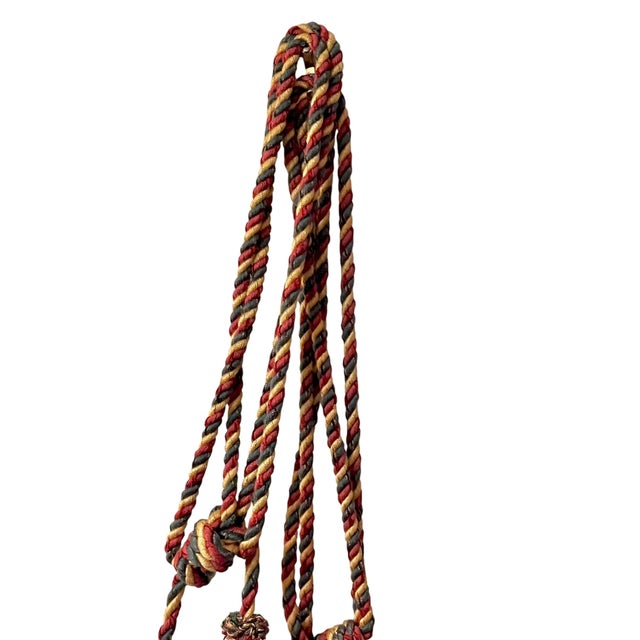 Add a touch of timeless elegance to your décor with this vintage decorative tassel accent. Featuring richly blended shades...
