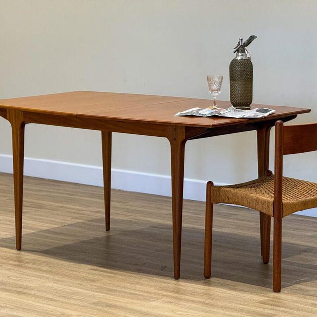 Designed by Tom Robertson and handcrafted by A.H. McIntosh & Co. in Scotland during the 1960s, this exceptional dining...