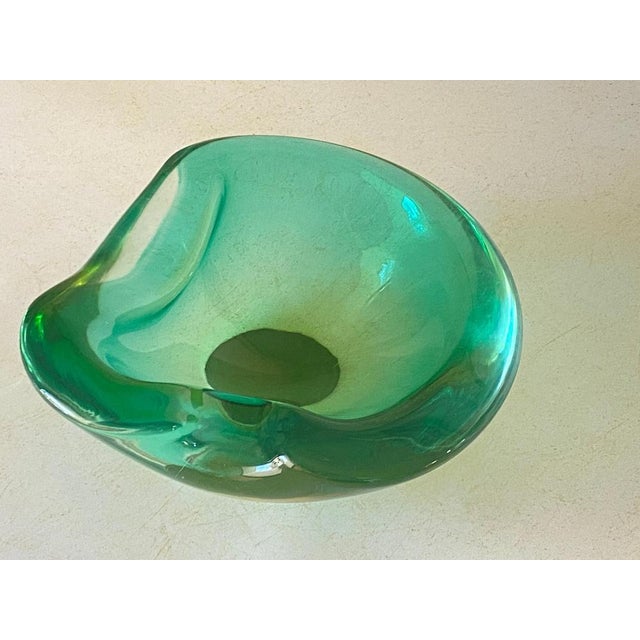 This vide poche or ashtray in in Glass. It has been done circa 1970, in Murano, Italy\. The shape is a free form....