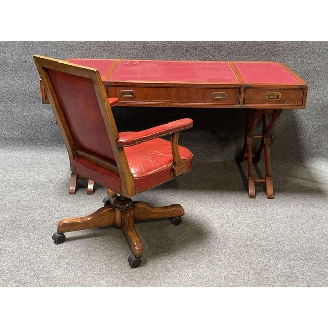 A distinctive Mid-Century Modern campaign-style writing desk by Brandt Furniture, combining classic military-inspired...