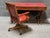 A distinctive Mid-Century Modern campaign-style writing desk by Brandt Furniture, combining classic military-inspired...