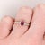This ring features a gorgeous pigeon blood red heated ruby from Madagascar, held in place by a compass pronged setting in...
