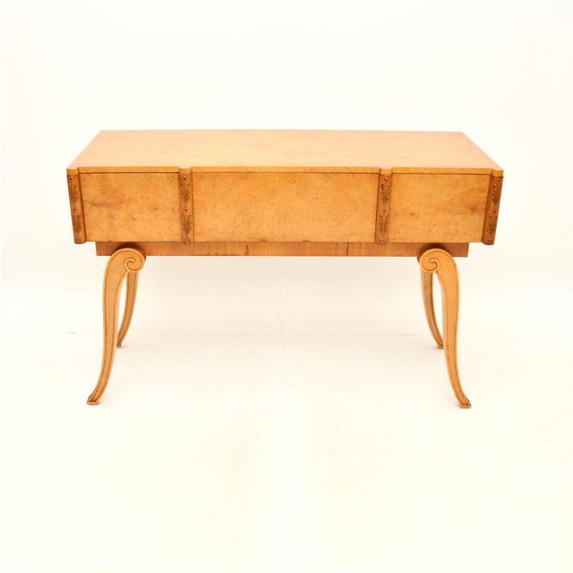 An exceptional Art Deco burr walnut console table by Hille. This was made in England, it dates from the 1920’s. The...