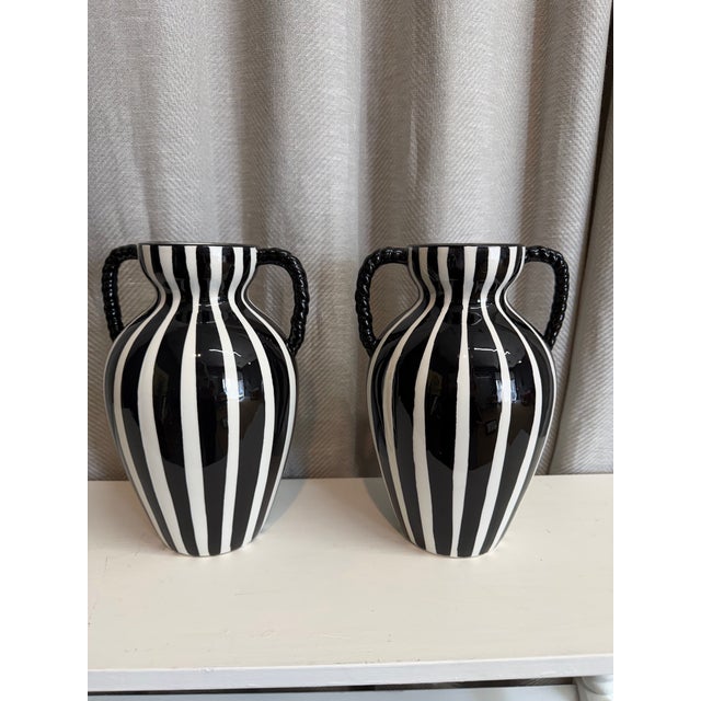 Gorgeous pair of handmade in Italy twisted handles striped black and white vases. No maker’s marks.