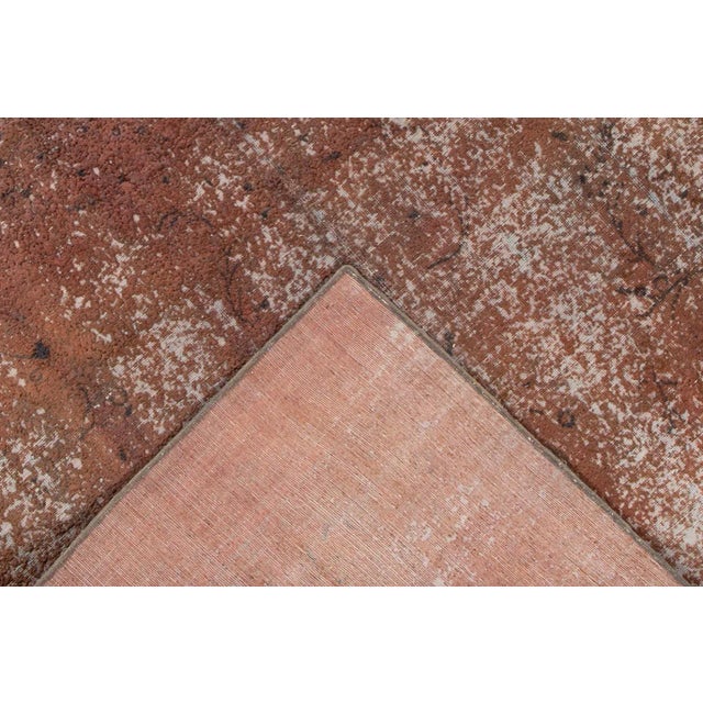 Vintage hand-knotted Overdyed rug with an all over motif. This piece has great detailing and a beautiful design. It would...