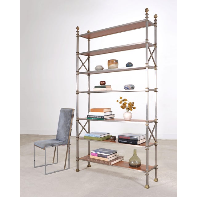 A stunning Italian mid-century modern steel and bronze étagère crafted in the style and manner of Maison Jansen. The...