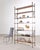 A stunning Italian mid-century modern steel and bronze étagère crafted in the style and manner of Maison Jansen. The...