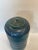 Hand thrown porcelain covered jar from 1945. It is in excellent condition with its cascading blue colors and sleek appeal.