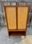 Mid Century Modern walnut and cane cabinet by Kipp Stewart and Stewart MacDougall for Drexel's Declaration collection....