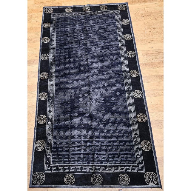 This captivating vintage Tibetan area rug from the first quarter of the 20th century is a work of serene sophistication...