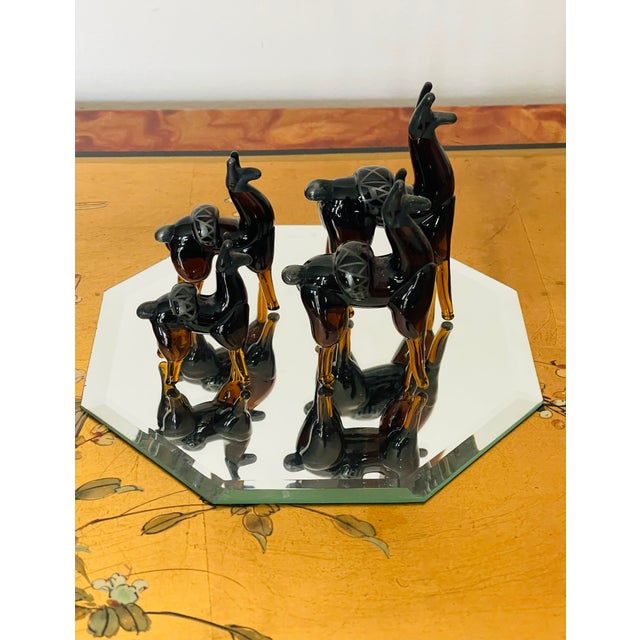 20 th c art blown glass cut glass vintage llama figurines family of 4 on a hexagonal mirrored stand.