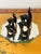 20 th c art blown glass cut glass vintage llama figurines family of 4 on a hexagonal mirrored stand.