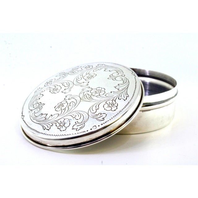 Circular Silver Box with Plant Reliefs, in Very Good conditions. Designed 1980 to 1989 This piece has an attribution mark,...