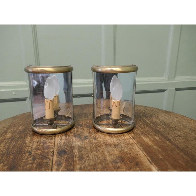A Pair of small French Brass Convex Wall Lanterns A lovely pair, these small lights each have 1 bulb with a mirror behind...