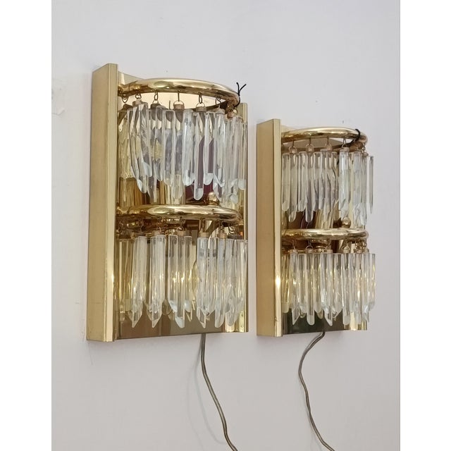 Magnificent pair of wall sconces by Lumica. Barcelona, ​​Spain, 1970s. They have never been used and still have their...